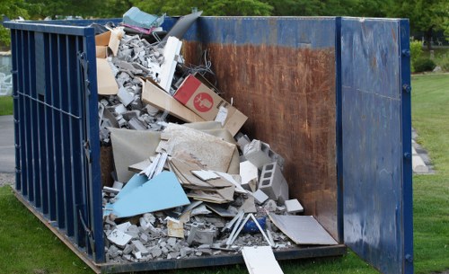 Professionals conducting loft clearance in Greenwich home